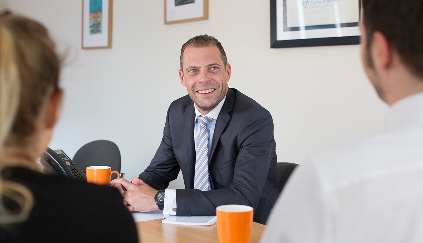 TAYLOR BRACEWELL TEAM MEETING IN OFFICE 