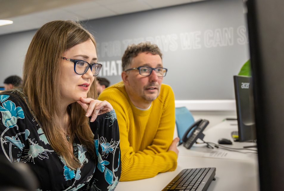 SEO specialists looking at keyword report
