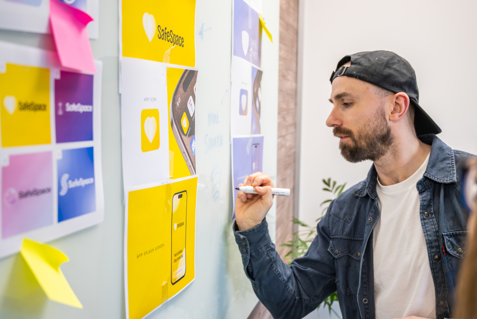 Graphic Designer presenting brochure design ideas